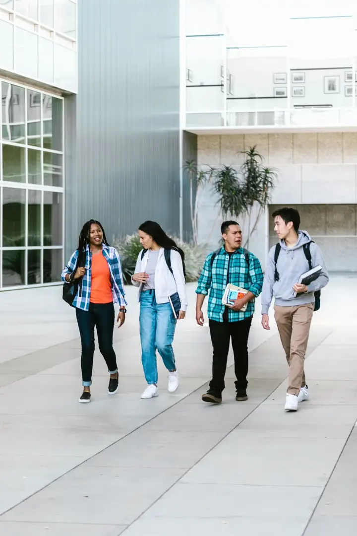 Group of students walking together on campus